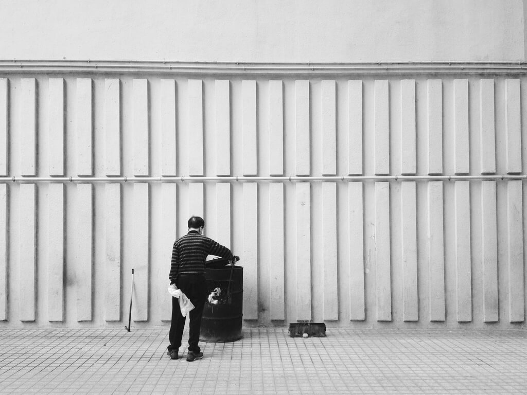 postoffis - man trash can - minimalist photography